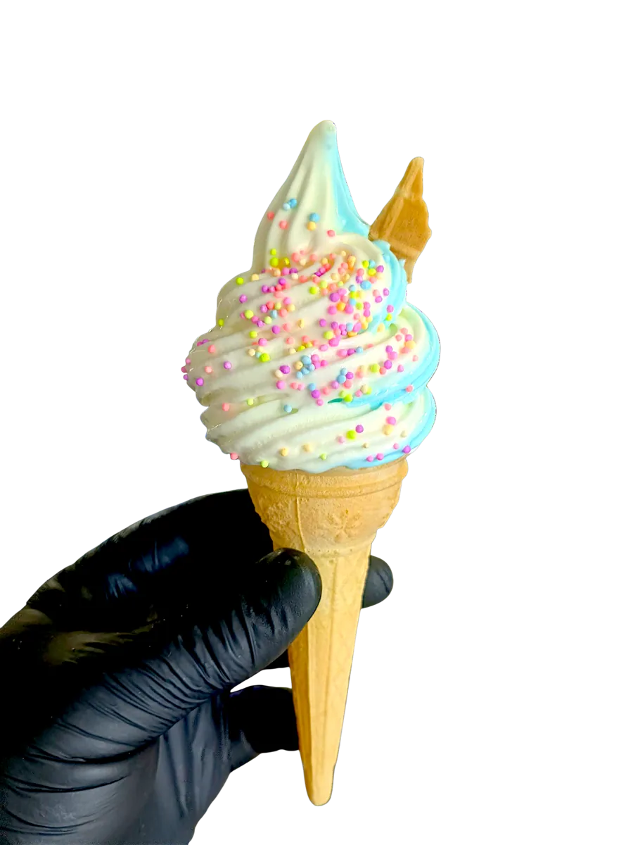 A pastel soft serve cone with sprinkles