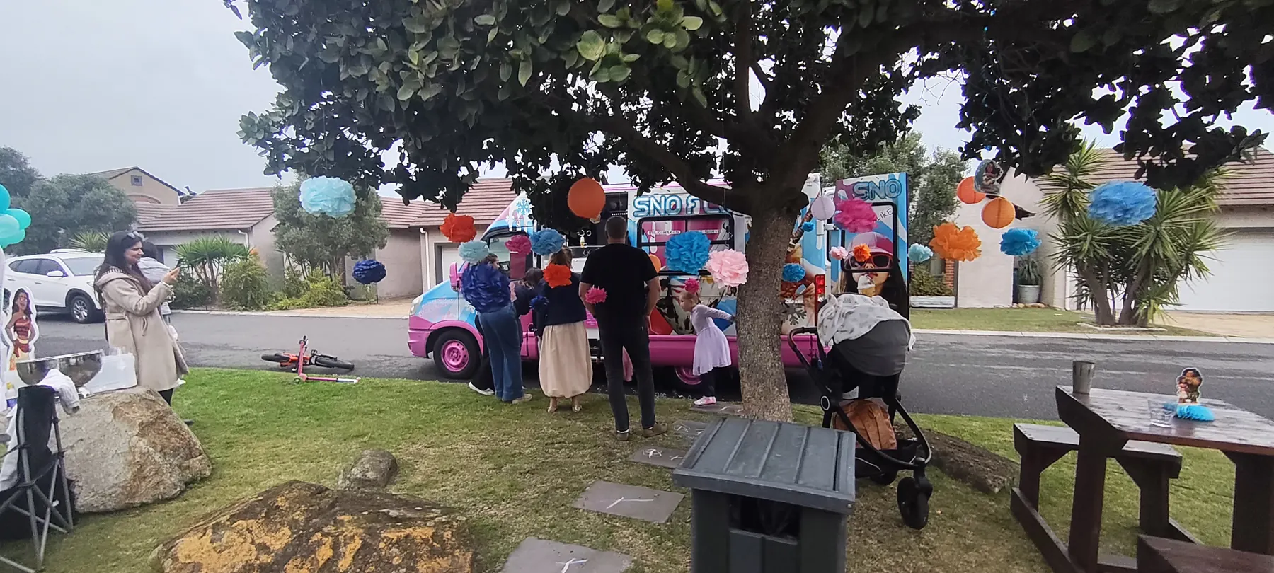 Children at a birthday party with the SNO FLO bus