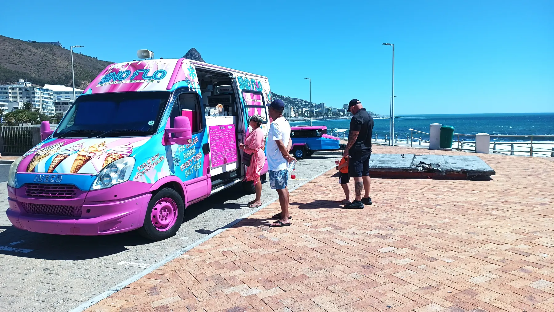 The SNO FLO bus on the beachfront promenade