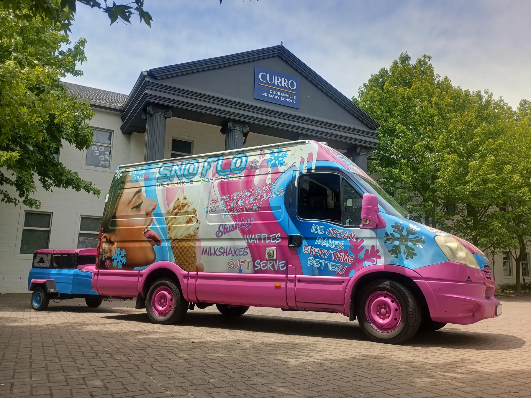 The SNO FLO bus parked at a Curro school